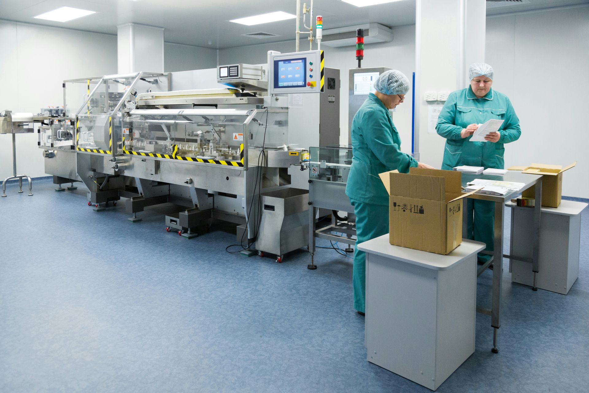 Finished goods being cased at the end of a packaging line